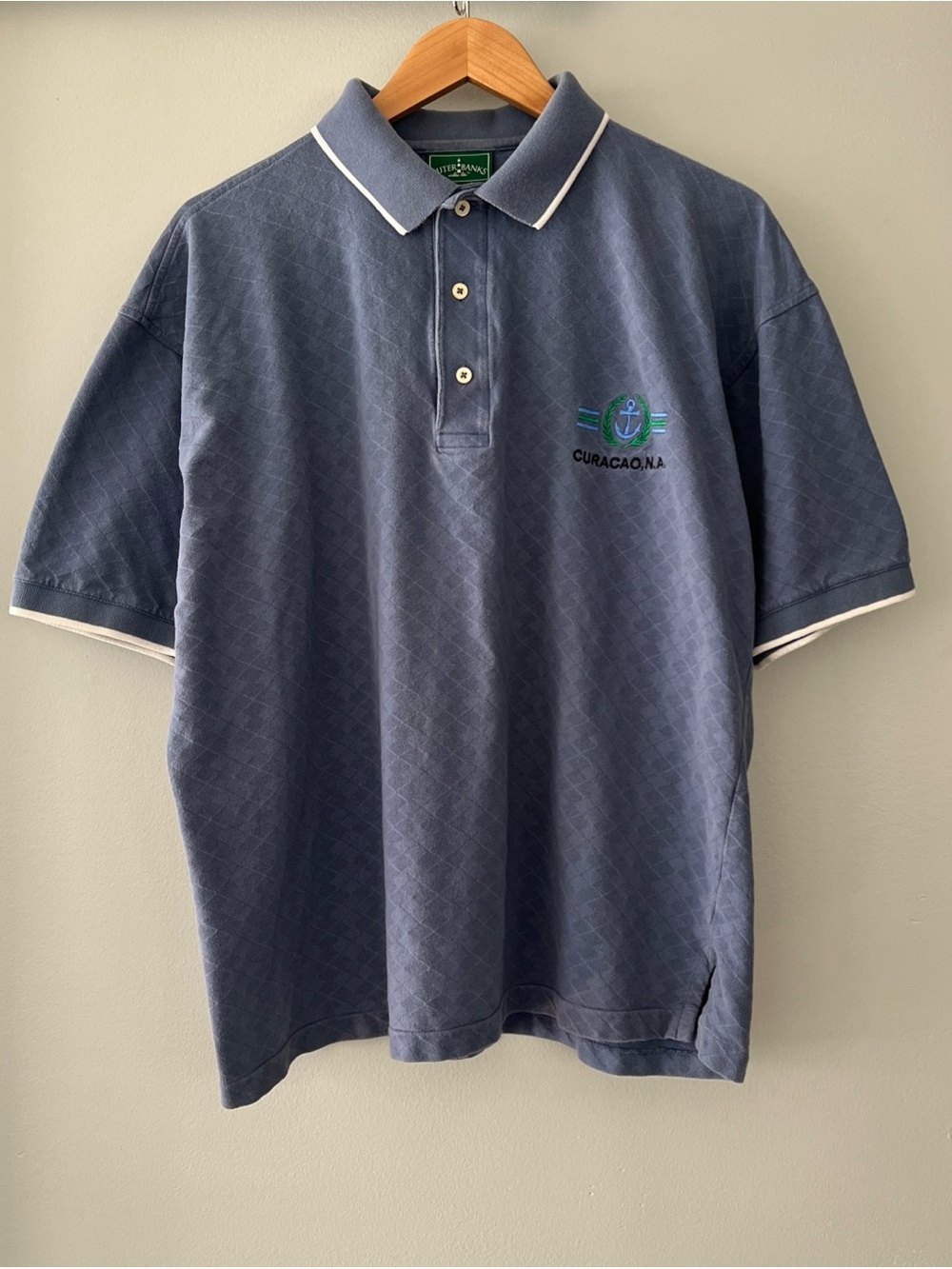 Outer Banks Curacao.NA Men's Navy Polo with White Contrast Trim Argyle Pattern
